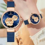 ساعت مچی زنانه نیوی فورس مدل NF5013 با بند آبی و صفحه گل‌دار - Image 2